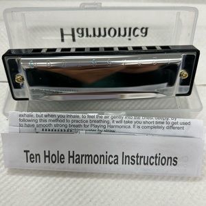 Silver and gold Harmonica size 1x3 inches